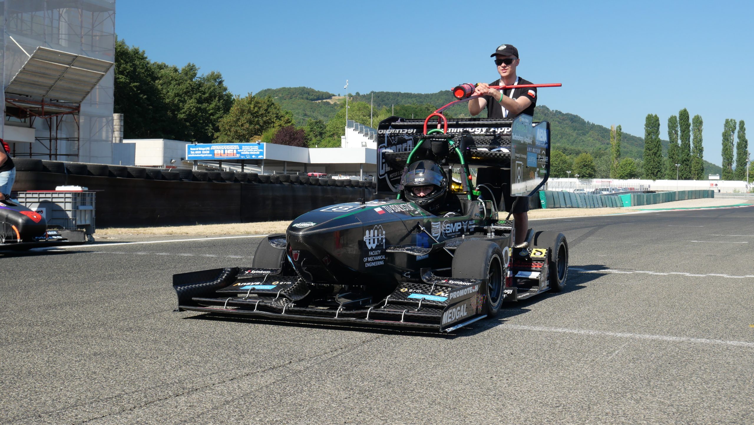 Students with the CMS-08 racing car compete in Formula SAE Italy ...