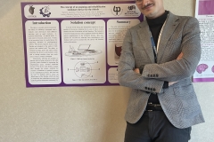 Kacper Snarski i plakat z konferencji